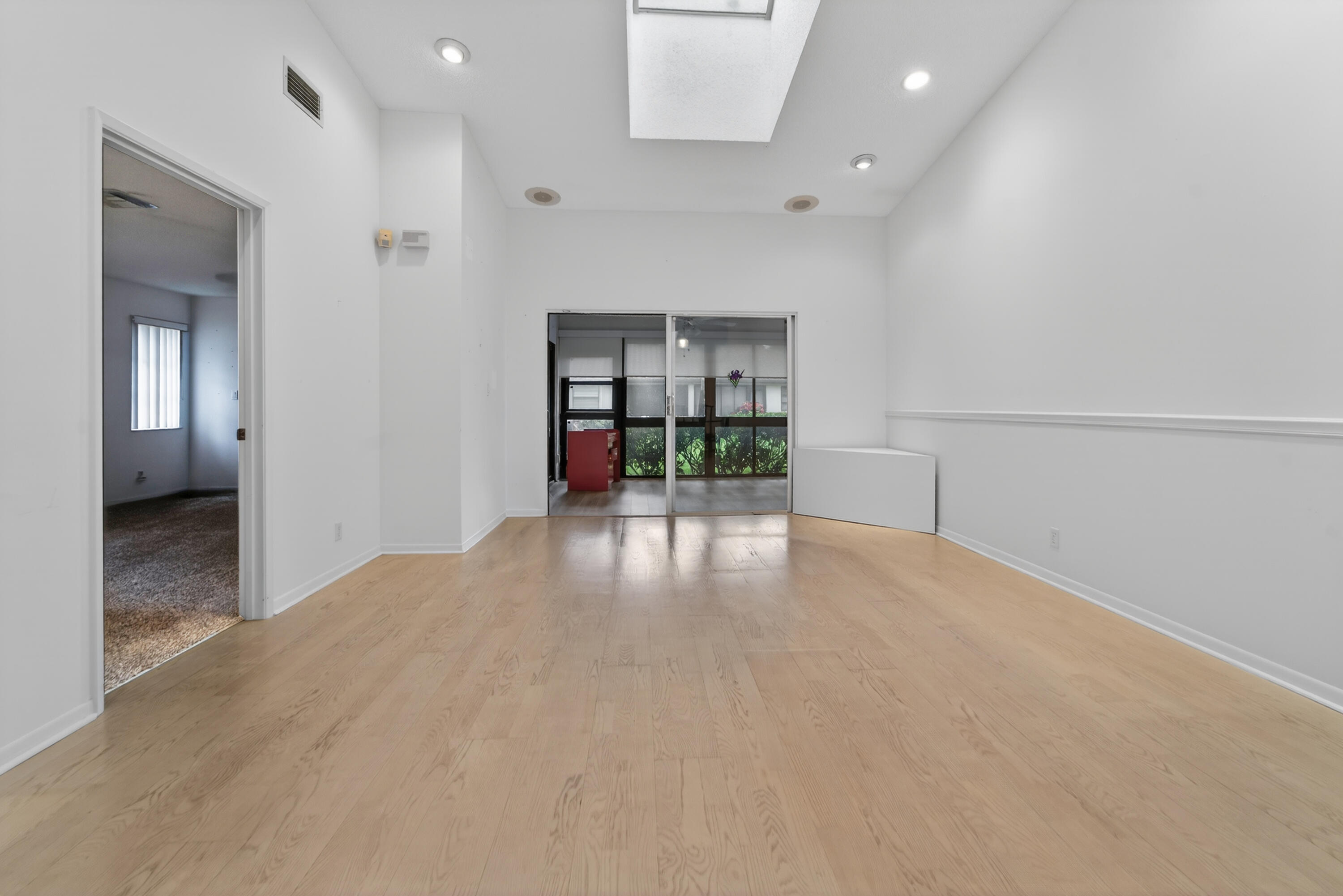 6371 Kings Gate Circle Delray Beach, FL 33484 - Photo 3 of 52 a view of empty room with window and fireplace