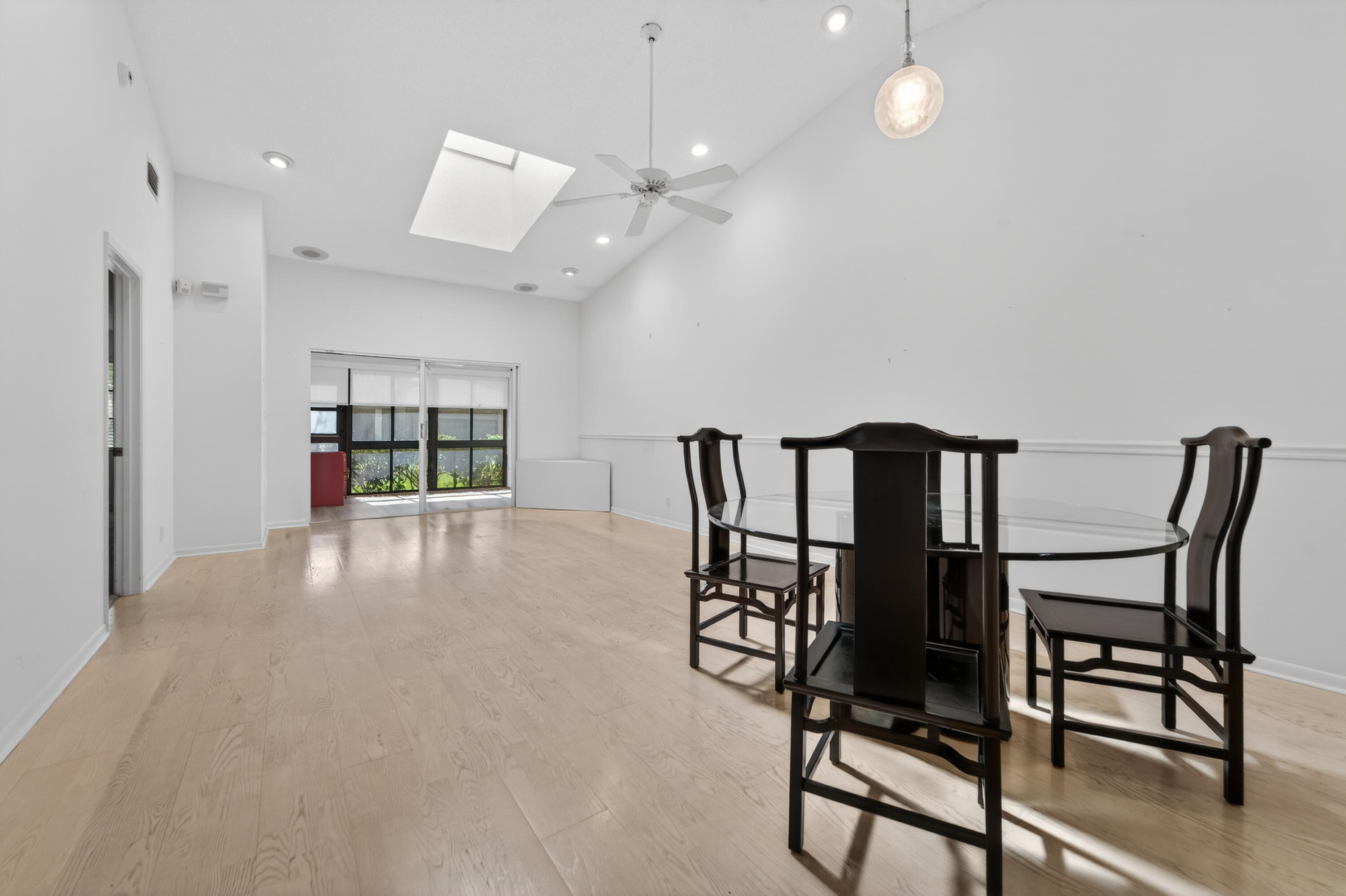 6371 Kings Gate Circle Delray Beach, FL 33484 - Photo 5 of 52 a view of a dining room with furniture and wooden floor