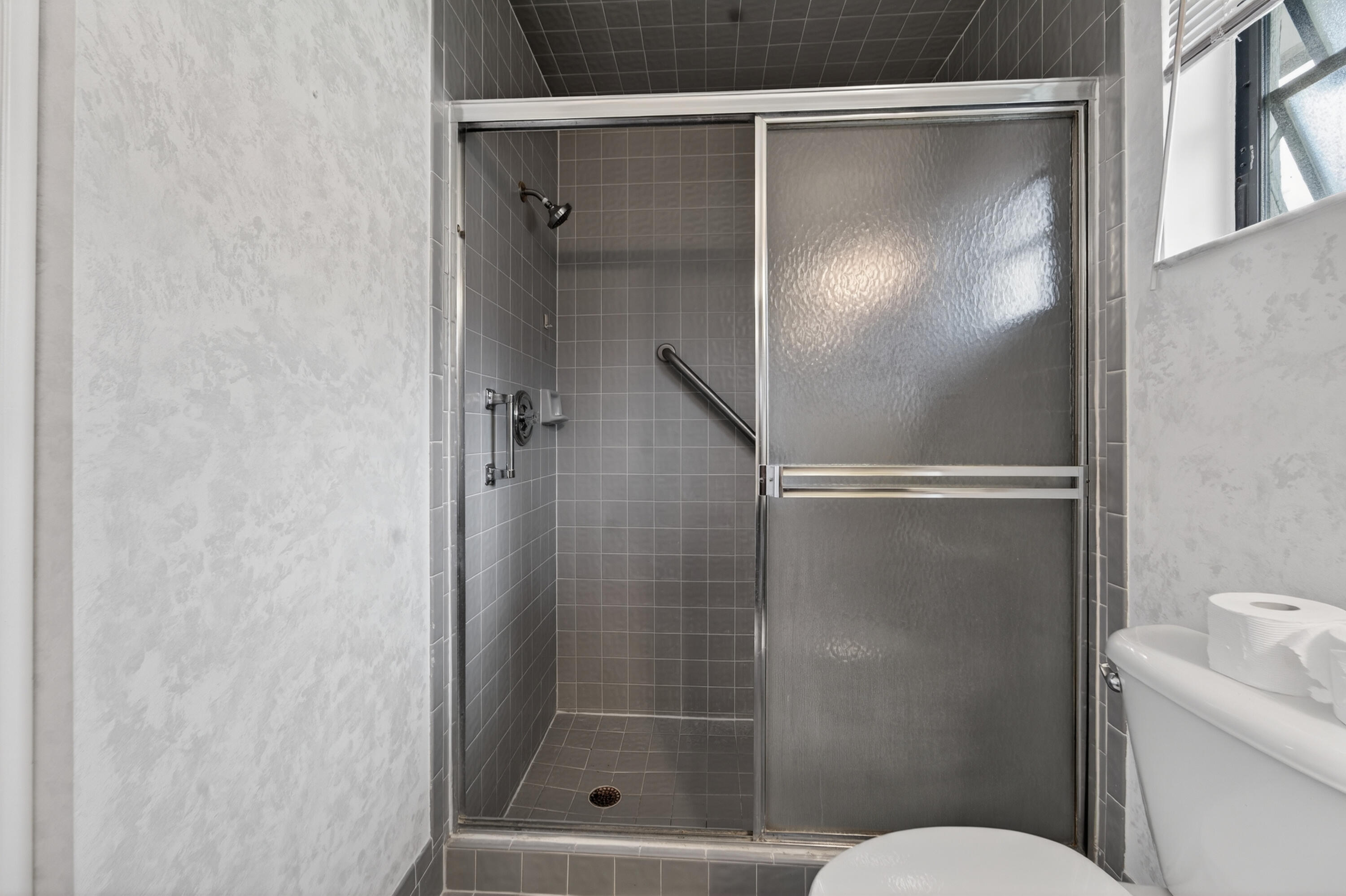 6371 Kings Gate Circle Delray Beach, FL 33484 - Photo 8 of 52 a bathroom with a shower and toilet
