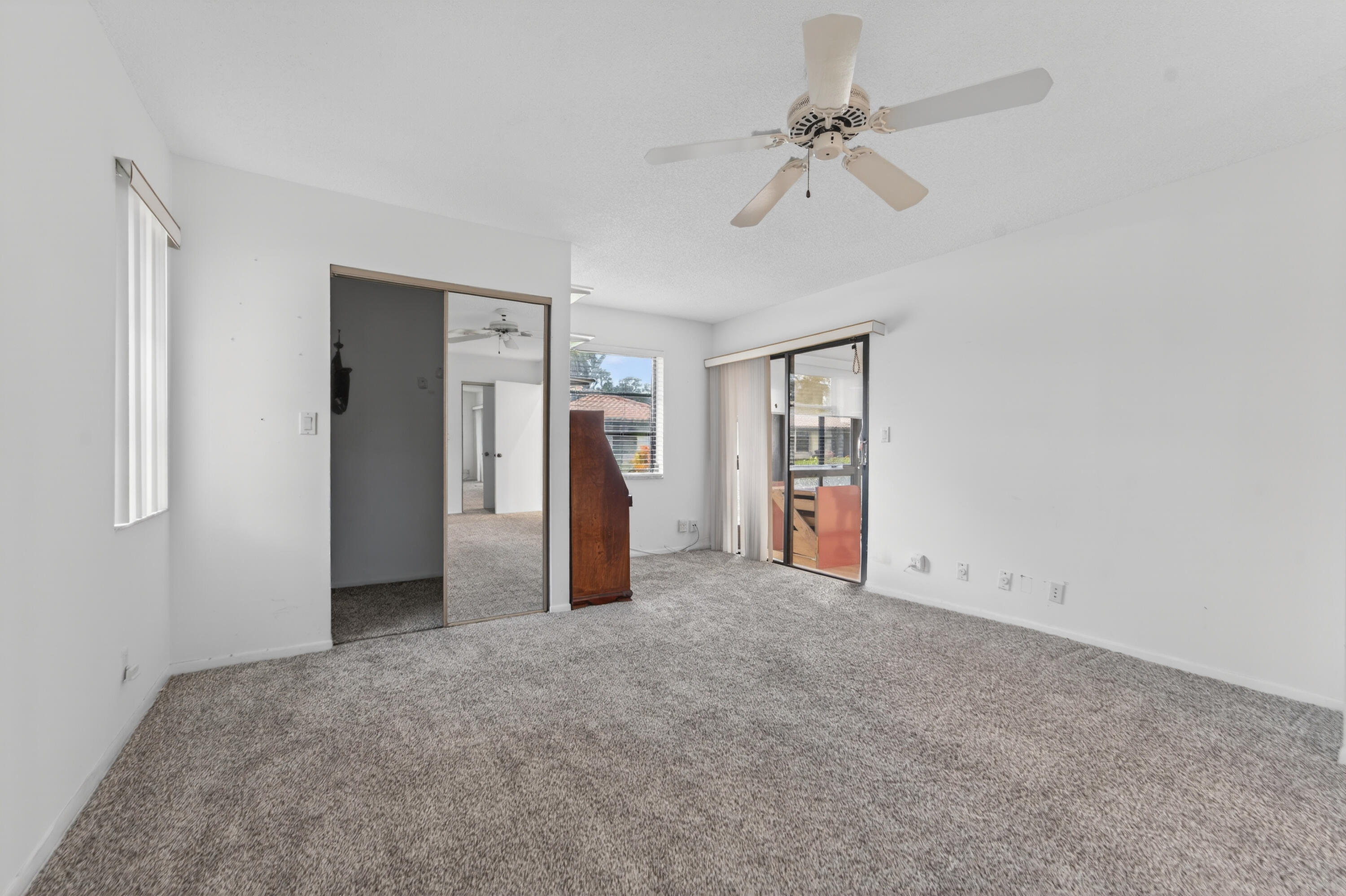 6371 Kings Gate Circle Delray Beach, FL 33484 - Photo 10 of 52 a view of an empty room with a ceiling fan