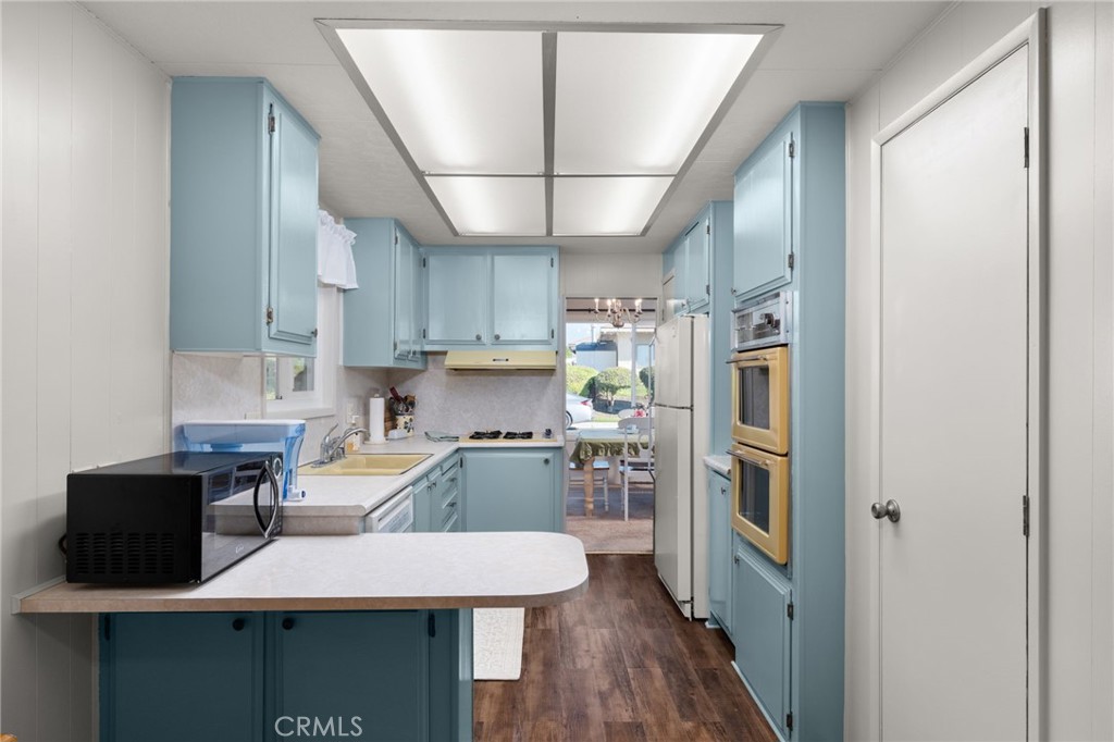 1331 Century Street Redlands, CA 92374 - Photo 11 of 35 a kitchen with stainless steel appliances a refrigerator and a stove top oven