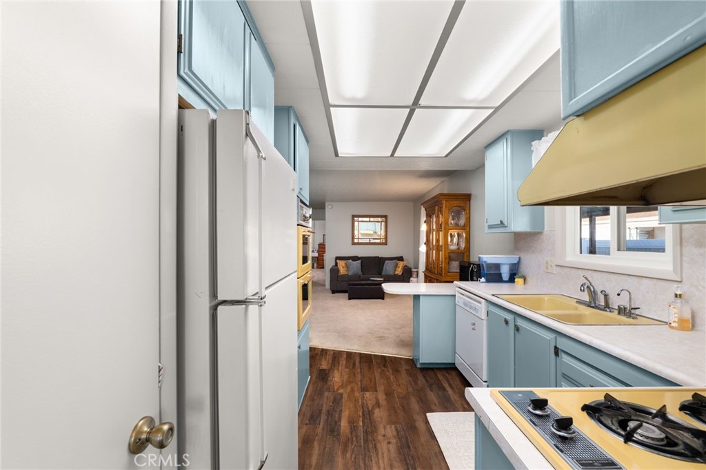 1331 Century Street Redlands, CA 92374 - Photo 13 of 35 a kitchen with a sink stainless steel appliances a counter space and a window