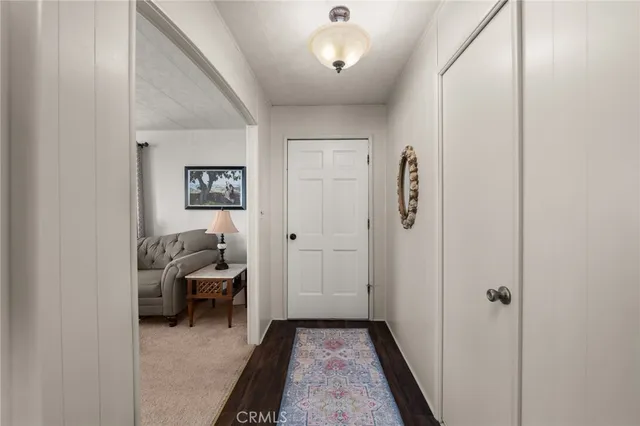 a view of a livingroom with furniture and closet area