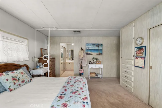 a bedroom with a bed and a cabinets