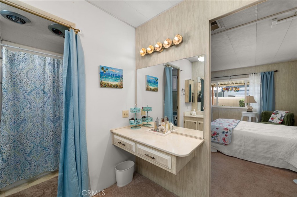 1331 Century Street Redlands, CA 92374 - Photo 20 of 35 a bathroom with a sink a mirror and a shower