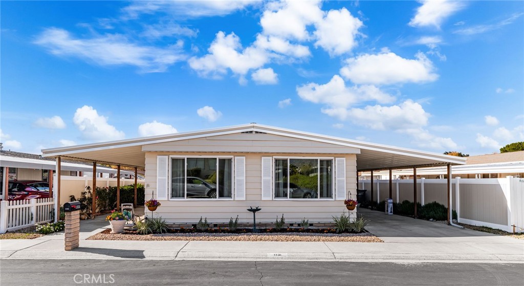 1331 Century Street Redlands, CA 92374 - Photo 2 of 35 a front view of a house with a garden