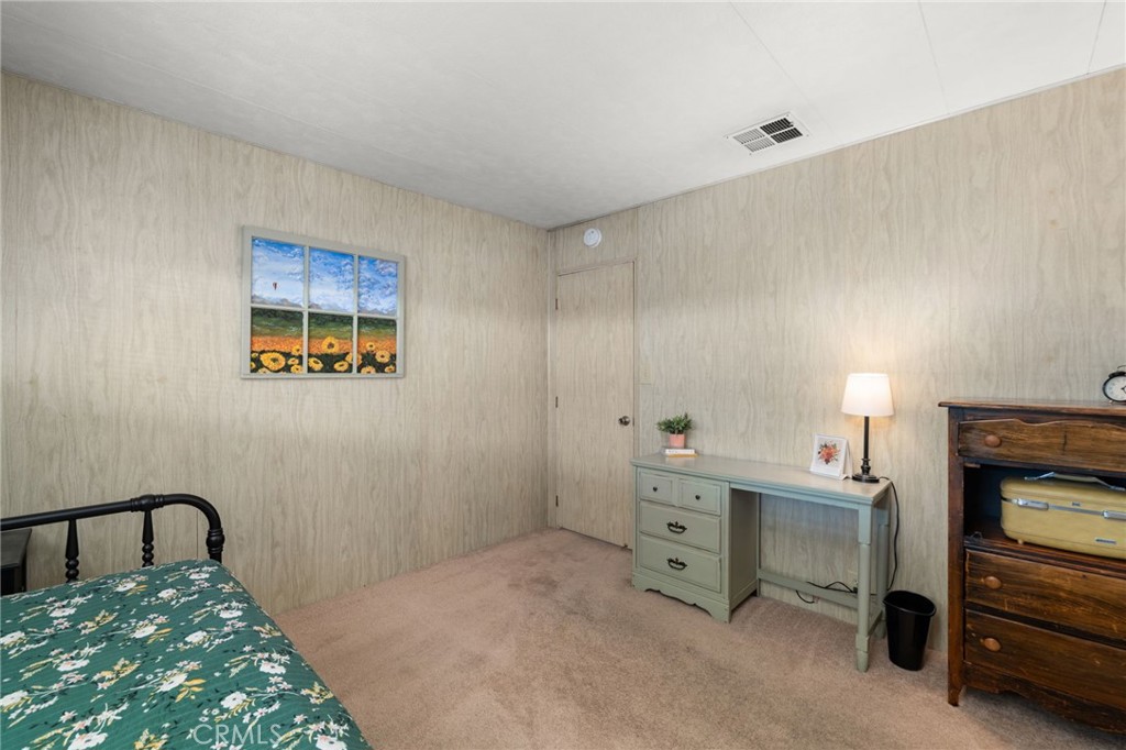 1331 Century Street Redlands, CA 92374 - Photo 22 of 35 a bedroom with a bed and a cabinets