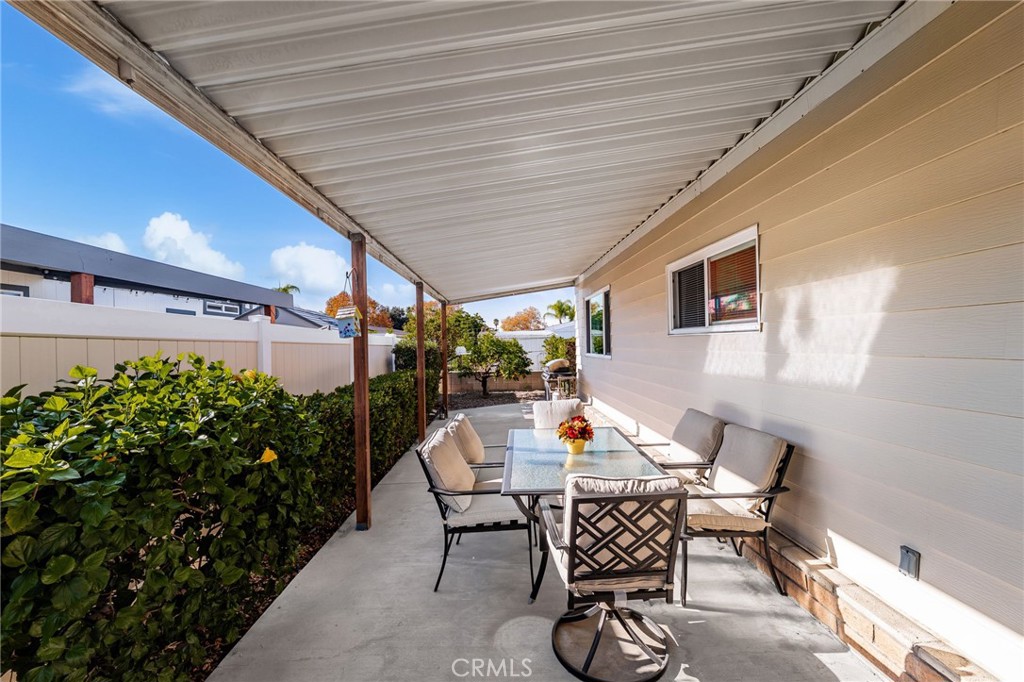 1331 Century Street Redlands, CA 92374 - Photo 25 of 35 a patio with table and chairs and potted plants
