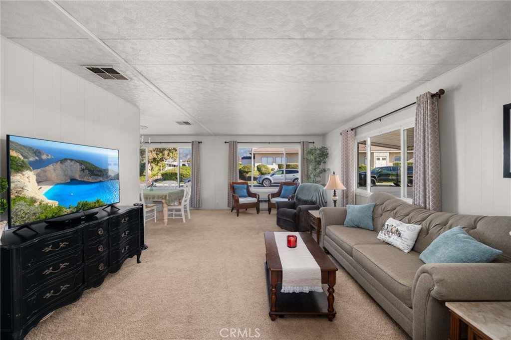 1331 Century Street Redlands, CA 92374 - Photo 6 of 35 a living room with furniture and a flat screen tv