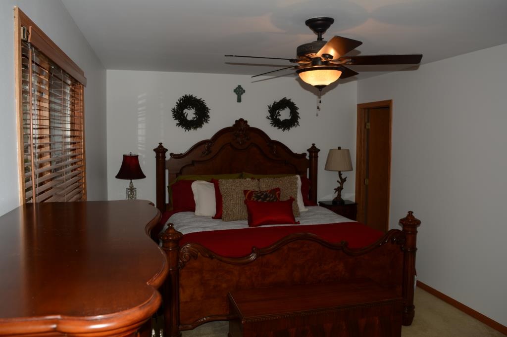 1286 Lake Summerset Road Davis, IL 61019 - Photo 13 of 25 a bedroom with a bed and dresser