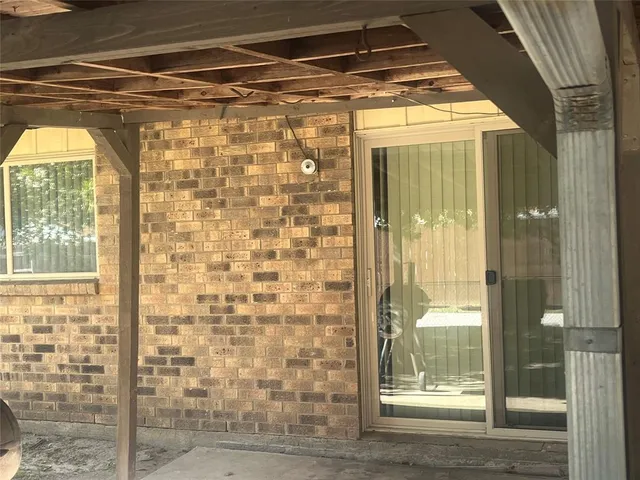 a bathroom with a glass door shower