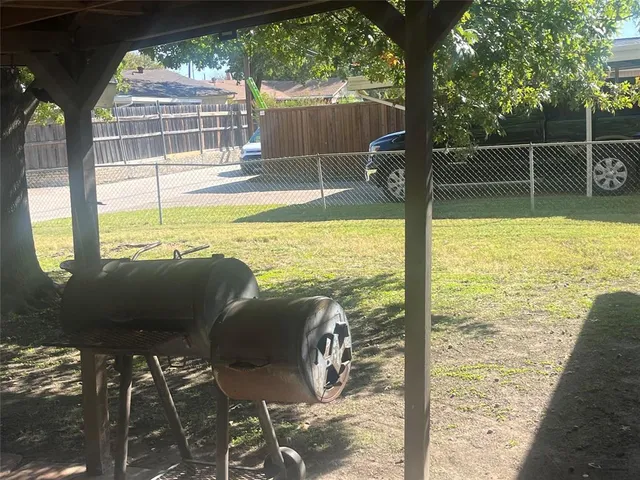 a view of a swimming pool with a patio