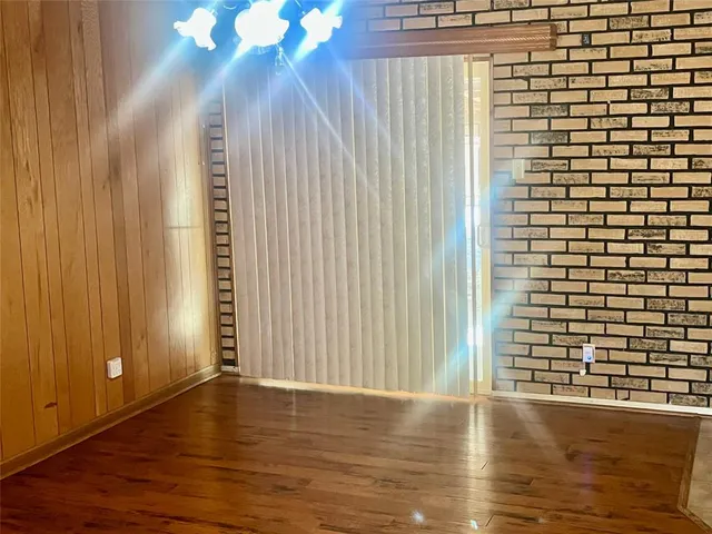 a view of a livingroom with wooden floor