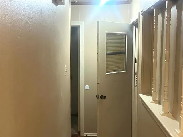 a bathroom with a shower and a glass door