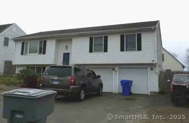a view of a car park in front of house