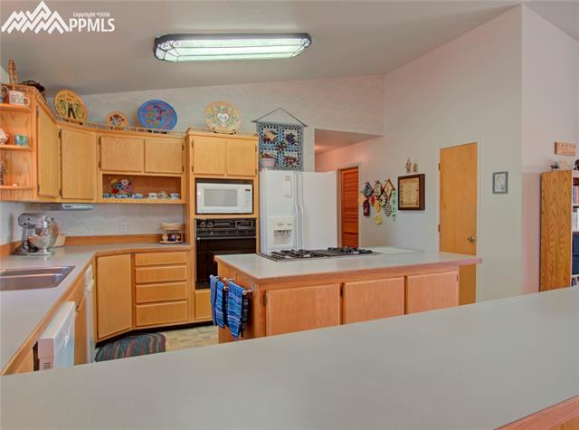 6890 Rio Road Peyton, CO 80831 - Photo 11 of 26 Custom cabinets and large pantry