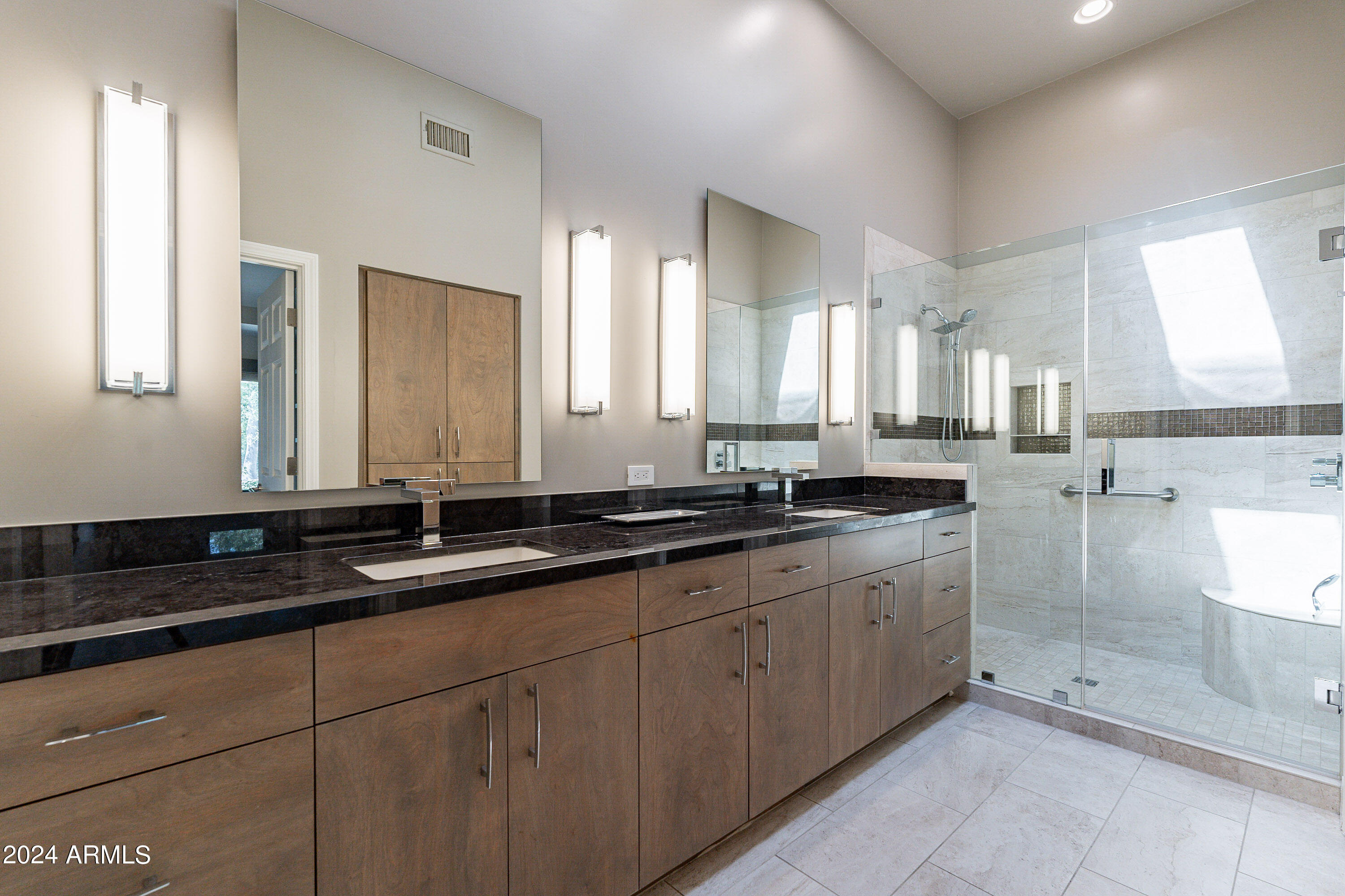 7272 East Gainey Ranch Road, Unit 101 Scottsdale, AZ 85258 - Photo 19 of 36 a large bathroom with a double vanity sink and a mirror