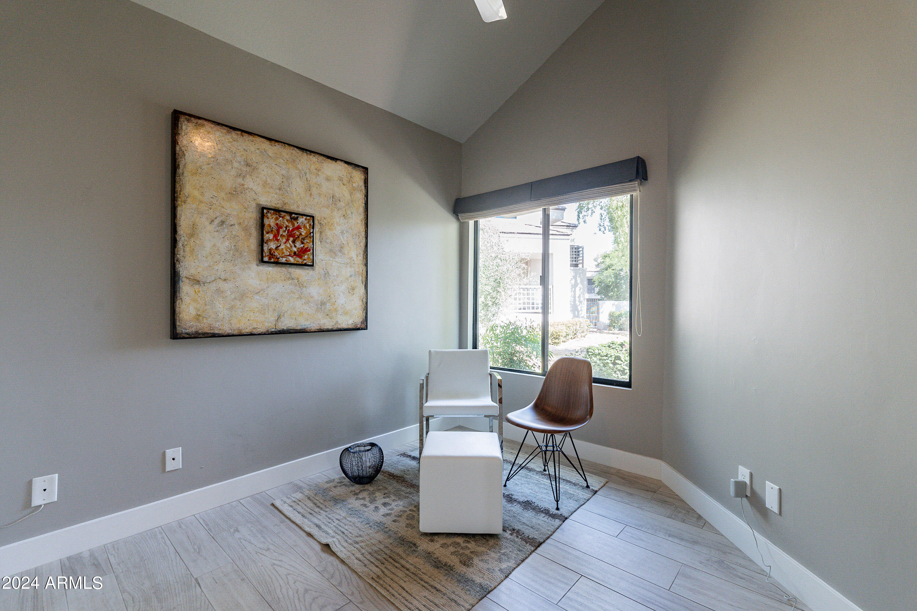 7272 East Gainey Ranch Road, Unit 101 Scottsdale, AZ 85258 - Photo 21 of 36 a living room with furniture and a window