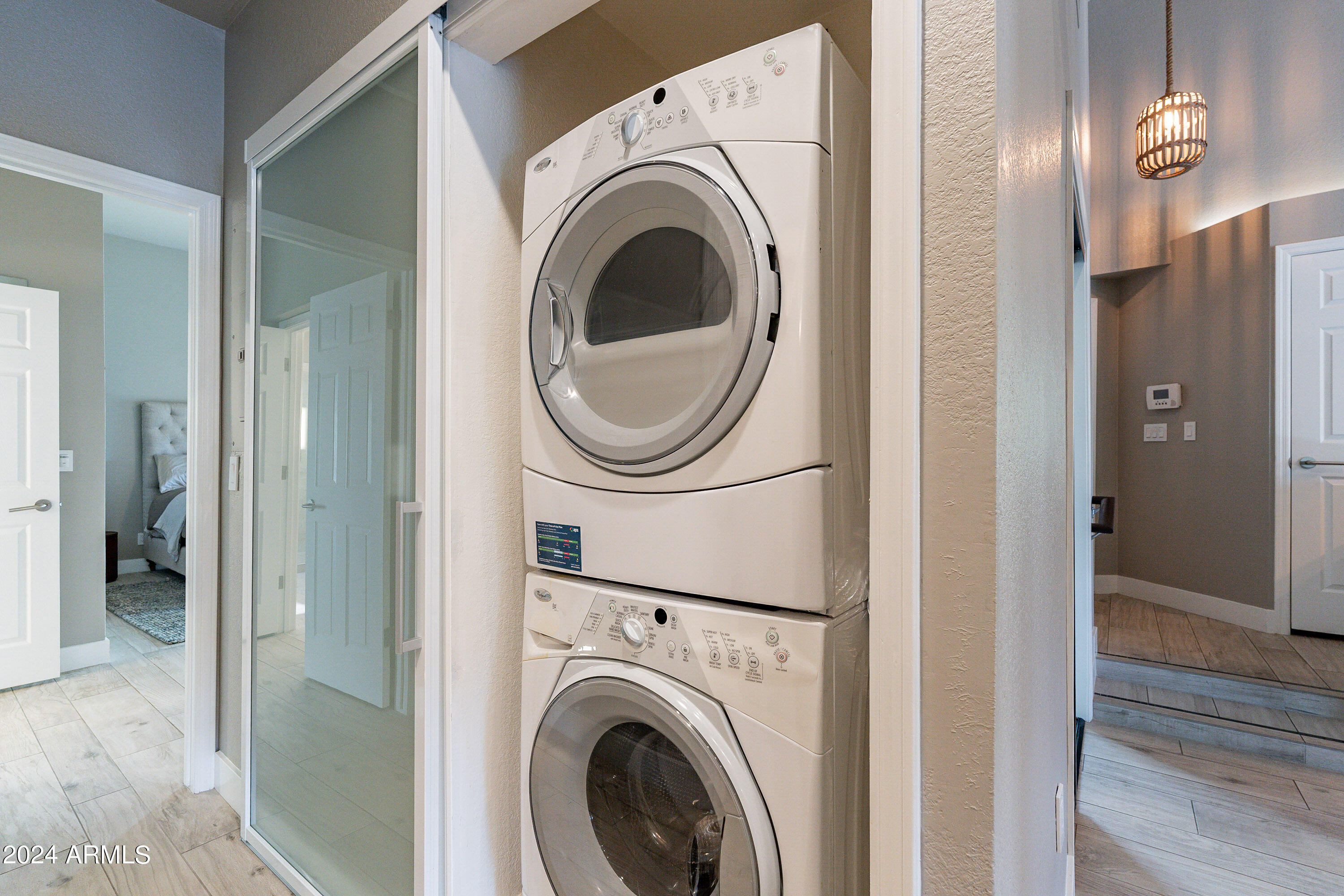 7272 East Gainey Ranch Road, Unit 101 Scottsdale, AZ 85258 - Photo 24 of 36 a view of a hallway with washer and dryer