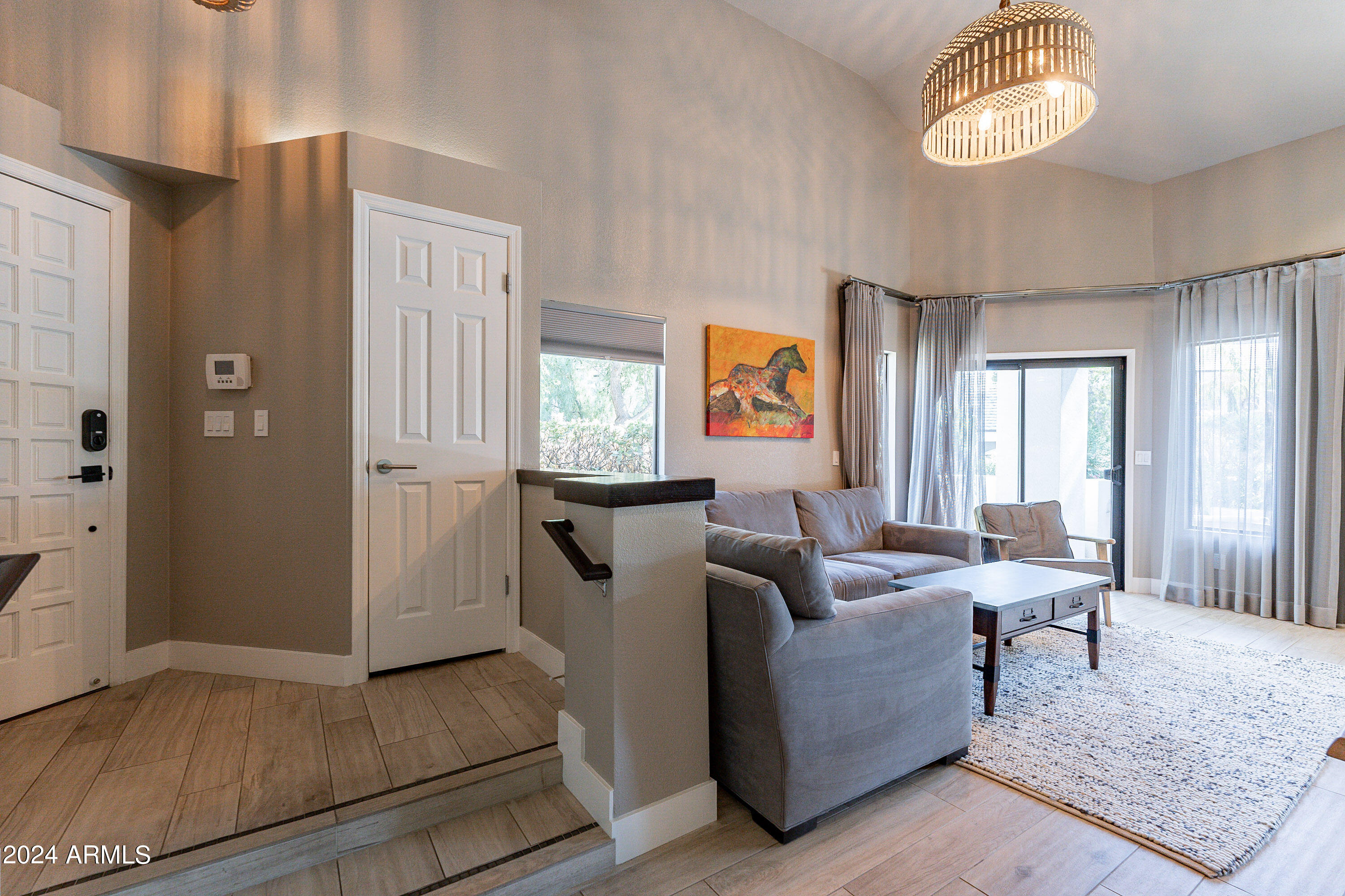 7272 East Gainey Ranch Road, Unit 101 Scottsdale, AZ 85258 - Photo 6 of 36 a living room with furniture and a window
