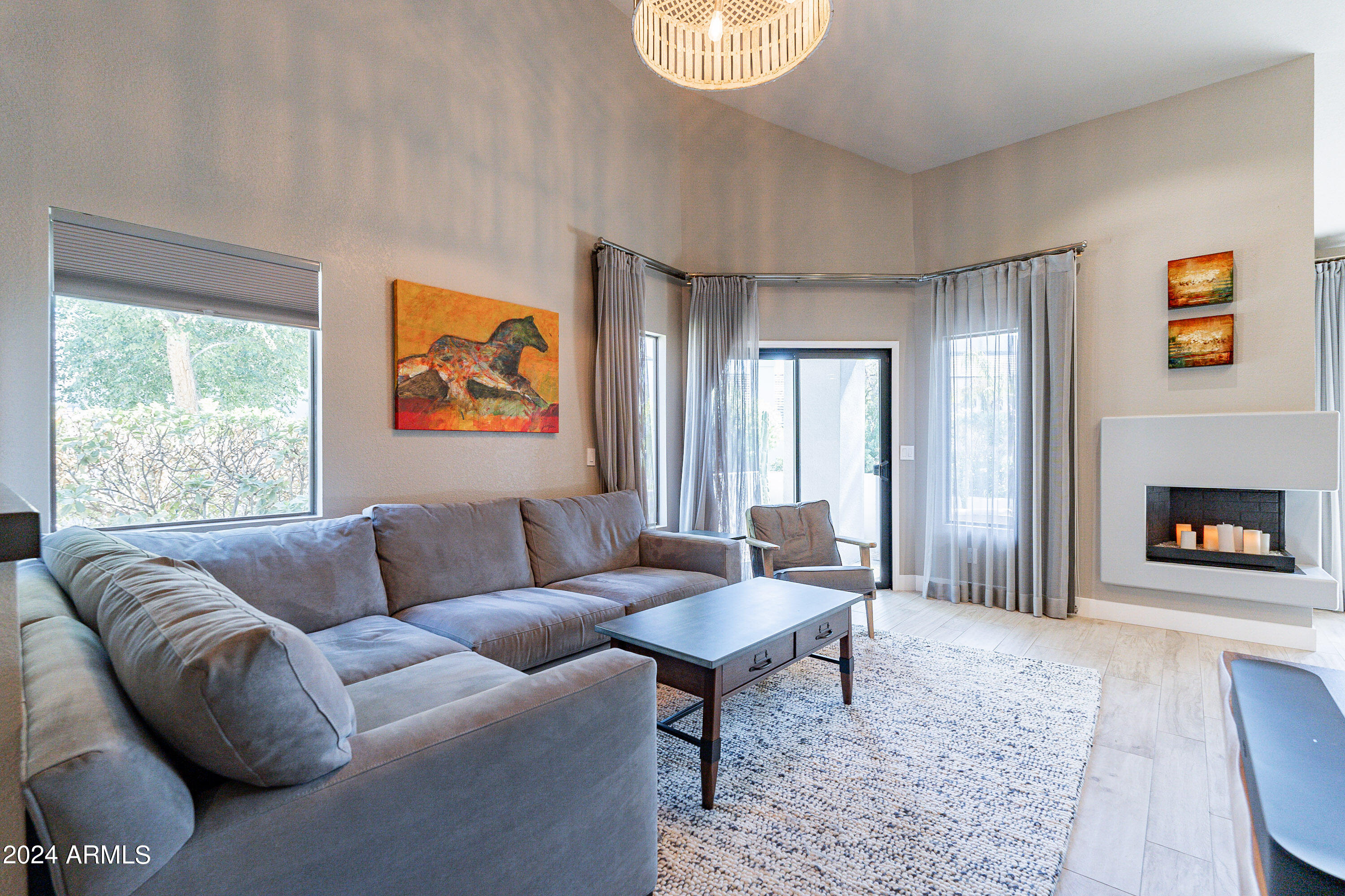 7272 East Gainey Ranch Road, Unit 101 Scottsdale, AZ 85258 - Photo 7 of 36 a living room with furniture and a window