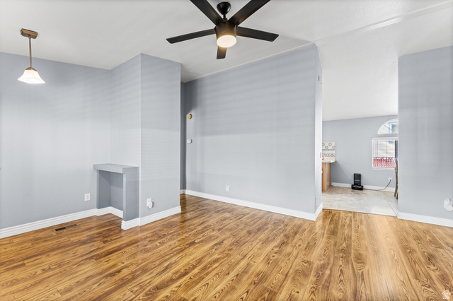312 Harriger Way Layton, UT 84041 - Photo 36 of 36 Spacious open floor plan with gleaming wood-finish flooring throughout