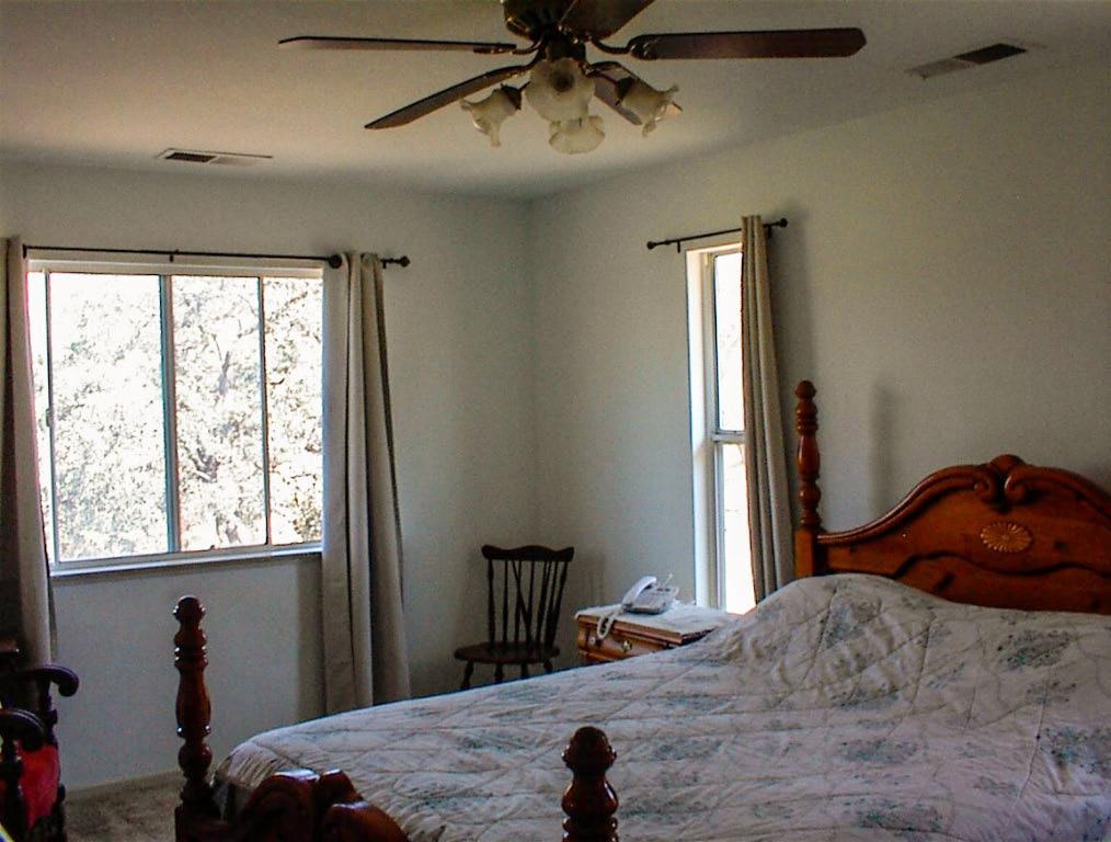 32860 George Smith Road Squaw Valley, CA 93675 - Photo 17 of 35 a bedroom with a bed and a window
