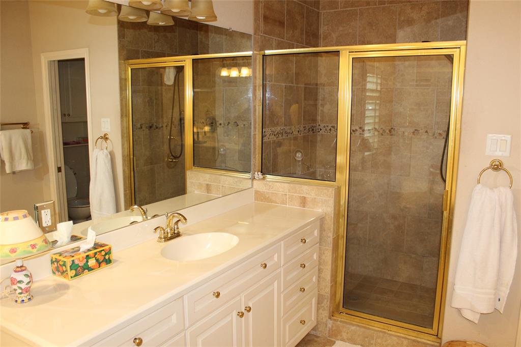 110 Bay Tree Trail Mabank, TX 75156 - Photo 14 of 20 a bathroom with a shower sink and mirror