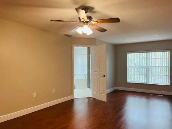 a bathroom with a tub a sink and mirror