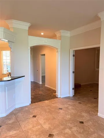 a view of a room with a sink and mirror
