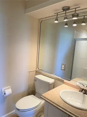 a bathroom with a toilet and a sink