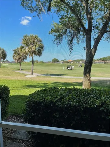 a view of a yard with an outdoor space
