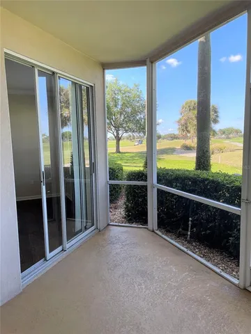 a view of an empty room with windows