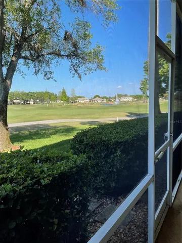 a view of a water heater and a floor to ceiling window