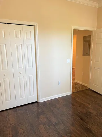 a view of an entryway with wooden floor