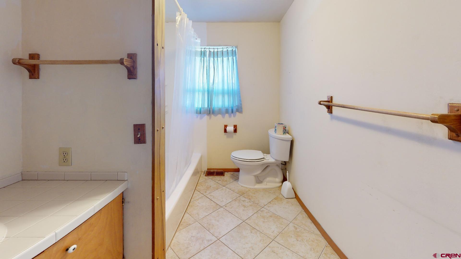 420 30 1/4 Road Grand Junction, CO 81504 - Photo 13 of 13 a bathroom with a sink a toilet and shower
