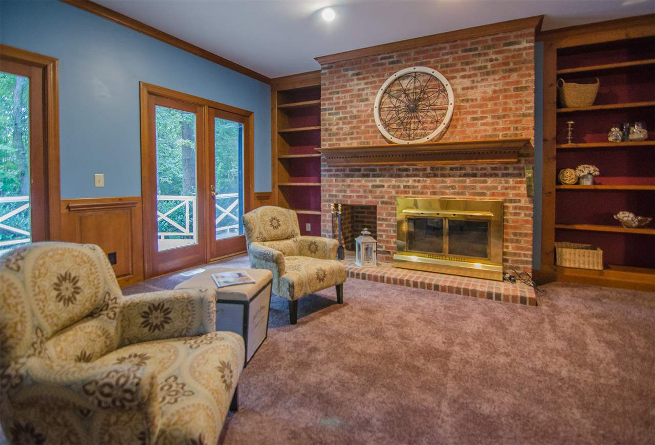 1301 Cool Spring Road Raleigh, NC 27614 - Photo 6 of 25 Beautiful masonry fireplace with wood built-ins on either side. Notice the nook for firewood in the fireplace. Family