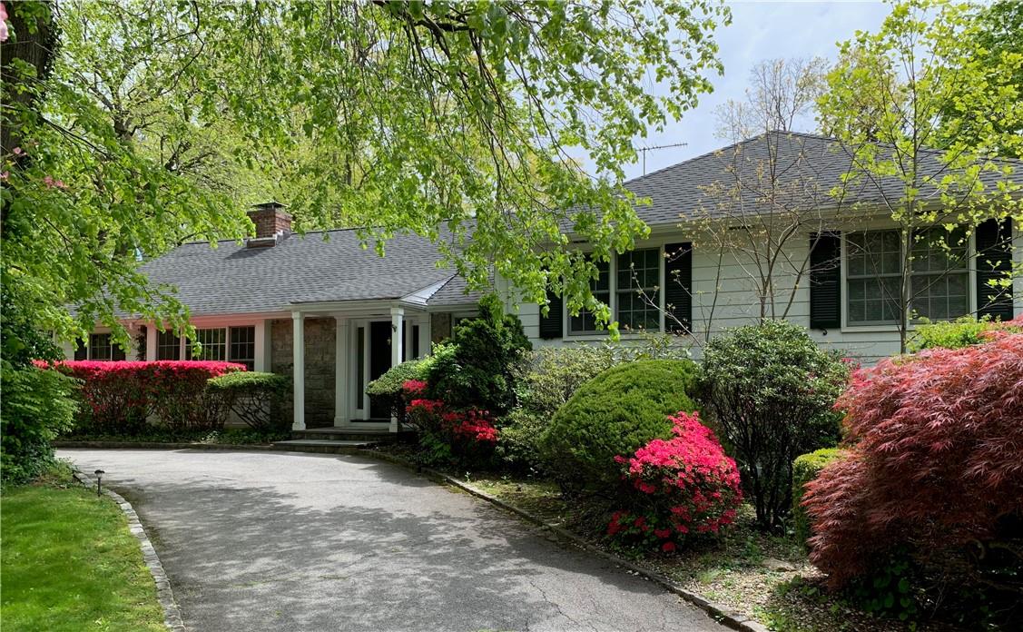 a view of a house with a garden