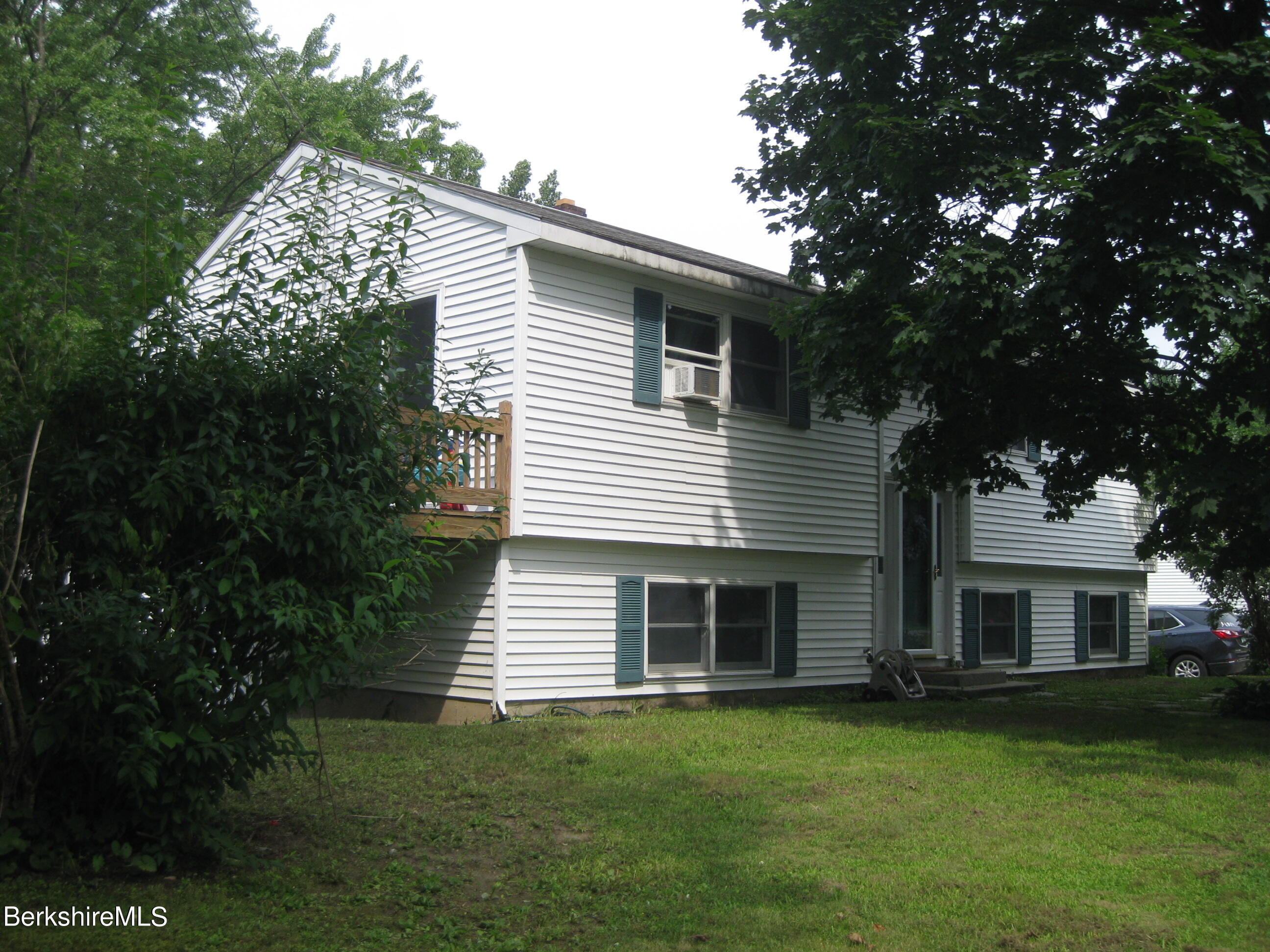 181 Matteson Road Bennington, VT 05257 - Photo 1 of 25 a front view of a house with a garden