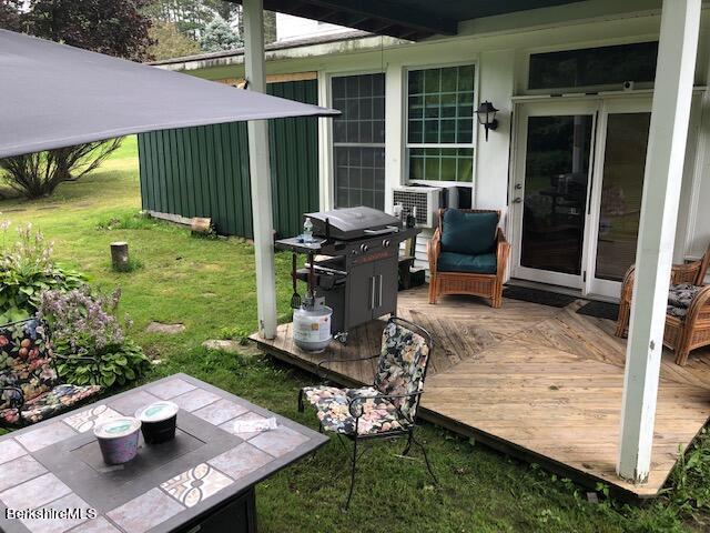 181 Matteson Road Bennington, VT 05257 - Photo 22 of 25 a view of a backyard with sitting area and garden