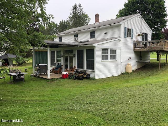 181 Matteson Road Bennington, VT 05257 - Photo 23 of 25 a view of a house with backyard and porch