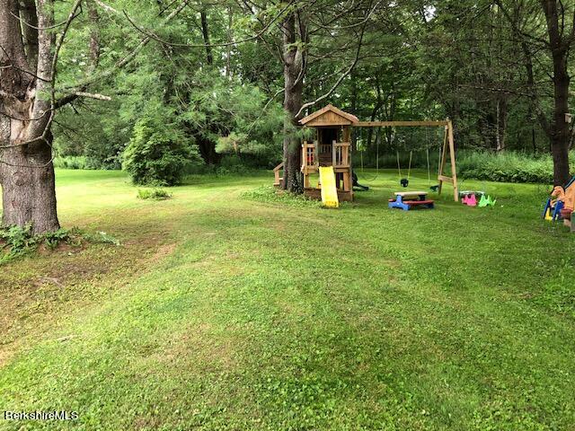 181 Matteson Road Bennington, VT 05257 - Photo 24 of 25 a view of a tiny house with a yard and sitting area