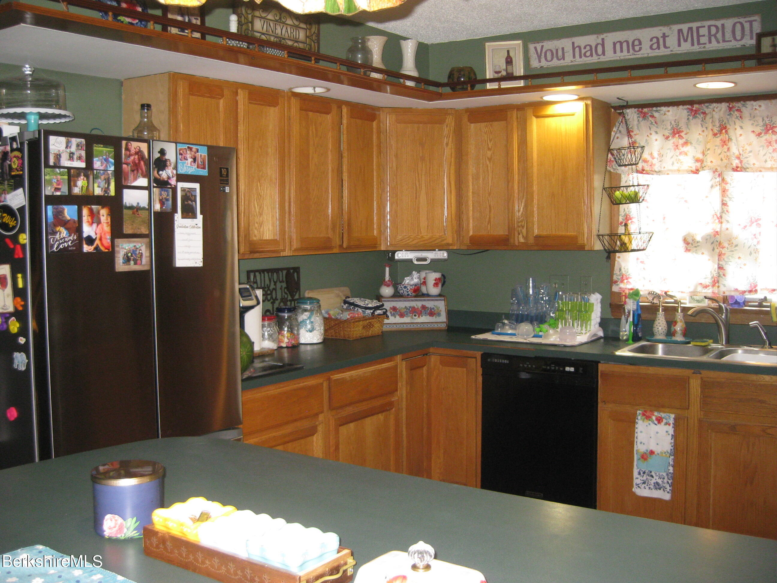 181 Matteson Road Bennington, VT 05257 - Photo 4 of 25 a kitchen with stainless steel appliances granite countertop a refrigerator and a sink