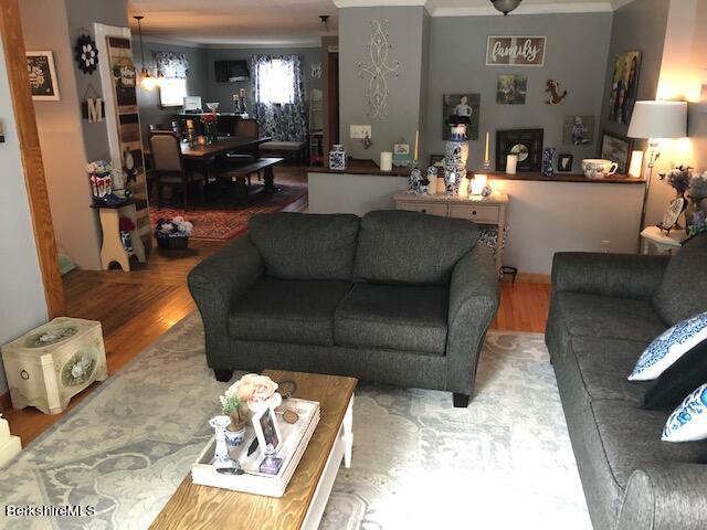181 Matteson Road Bennington, VT 05257 - Photo 6 of 25 a living room with furniture and a dining table