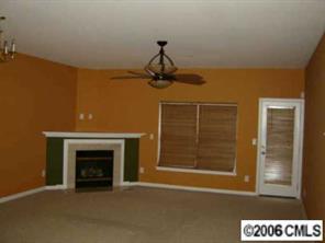 1037 Garrison Road Charlotte, NC 28262 - Photo 2 of 8 a view of empty room with fireplace