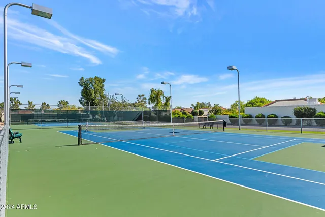 a view of a house with swimming pool and sitting area