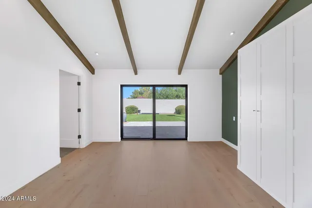 a view of empty room with windows