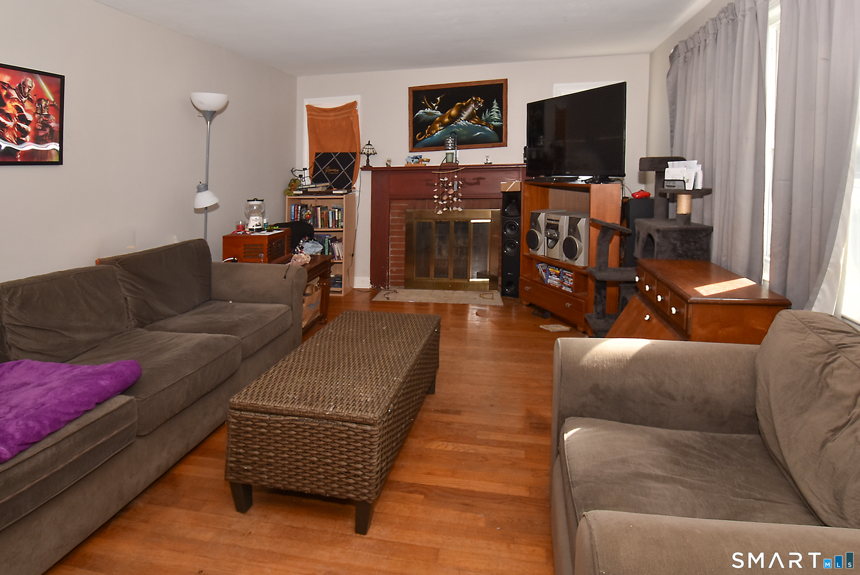 3 French Road Manchester, CT 06042 - Photo 4 of 20 a living room with furniture and a flat screen tv