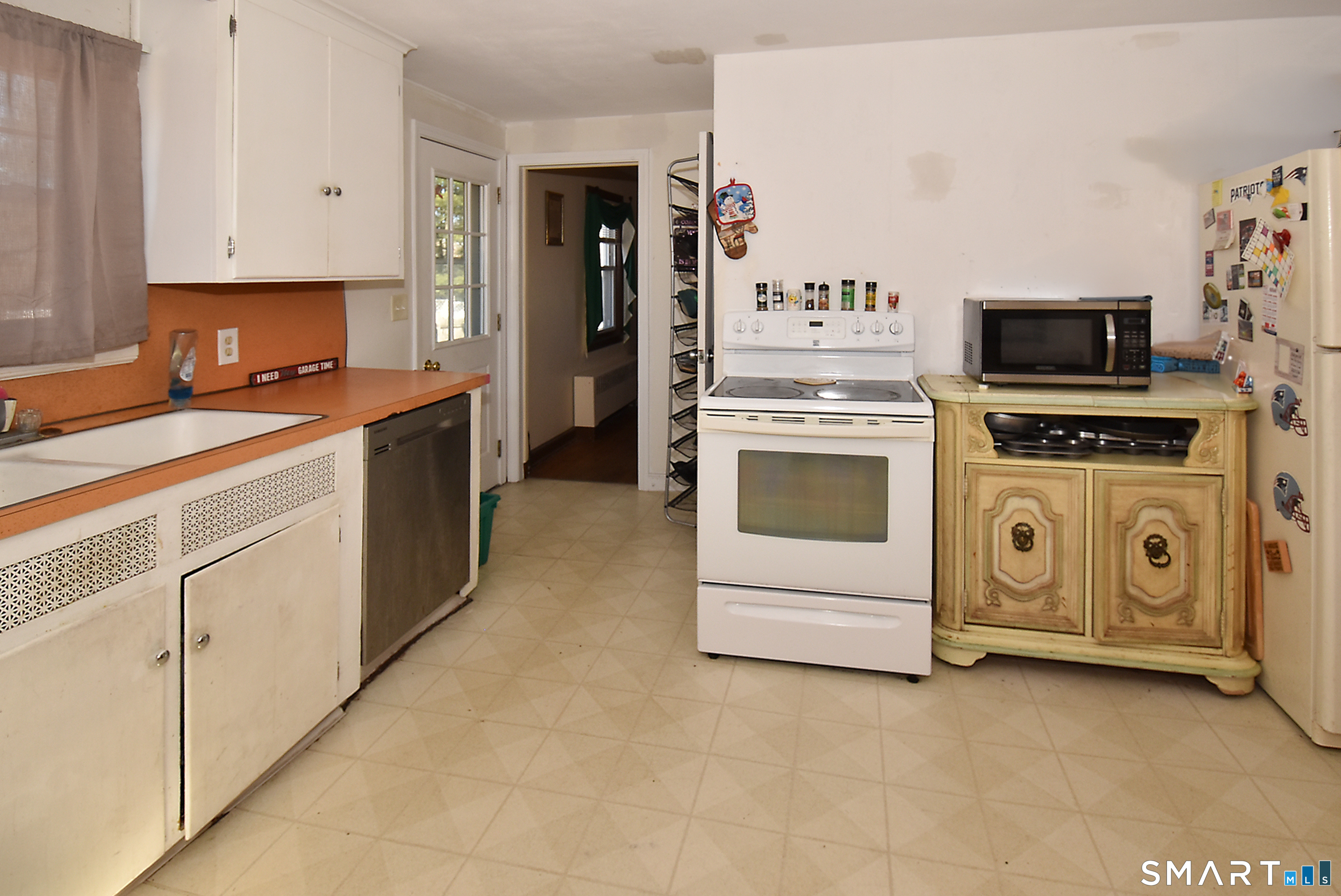 3 French Road Manchester, CT 06042 - Photo 8 of 20 a kitchen with stainless steel appliances a stove a microwave and a refrigerator