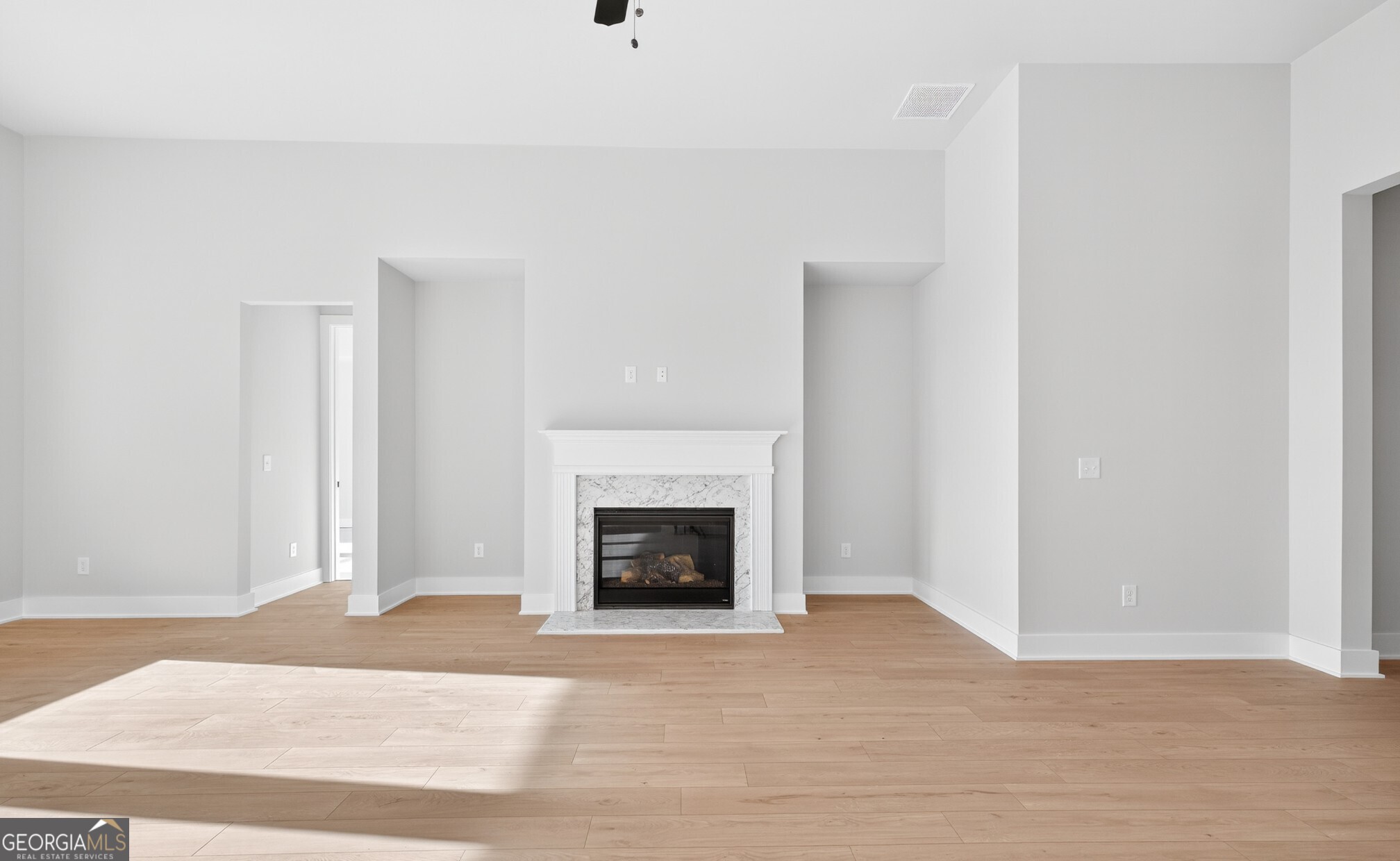 132 Patillo Manor, Unit 8 Stockbridge, GA 30281 - Photo 17 of 36 a view of a livingroom with a fireplace